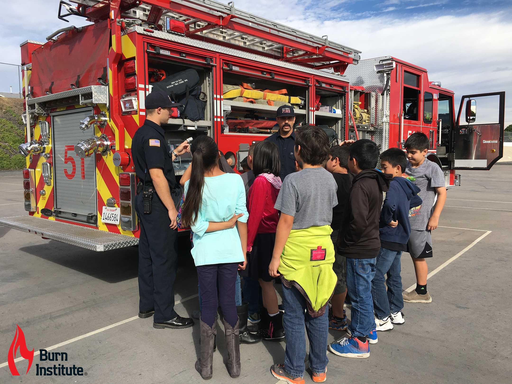 Picture of Fire Safe Kids Program - firefighter interacting with kids 