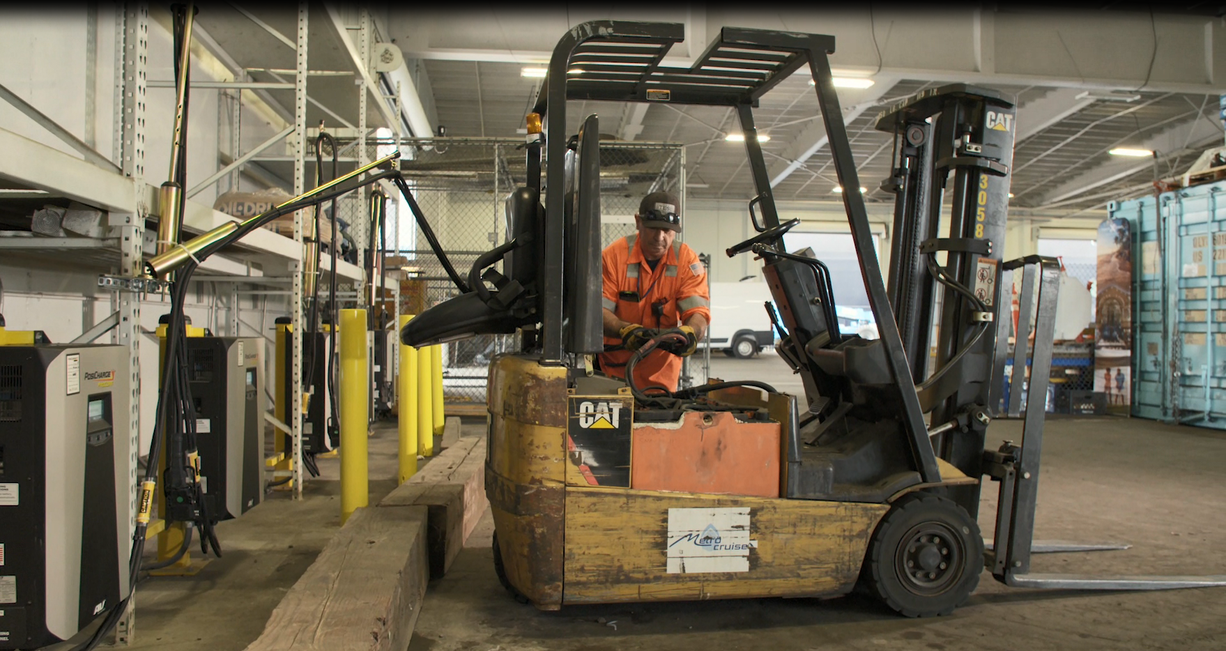 The Port's electric forklift being plugged into the new and efficient charging stations.
