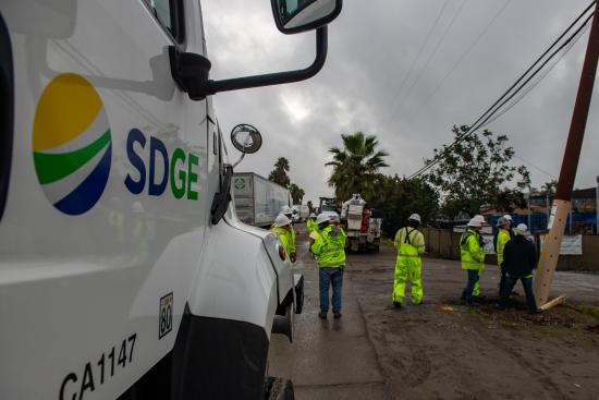 SDG&E field crews inspecting a damaged power pole