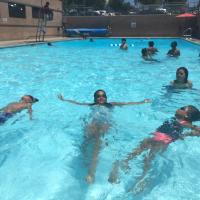 Kids learning how to swim at the Barrio Station Pool. 